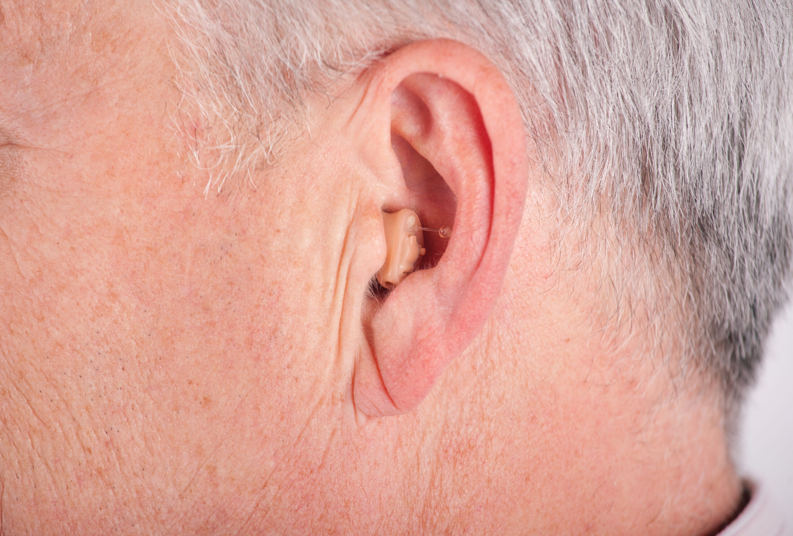 Elderly people wearing hearing aids